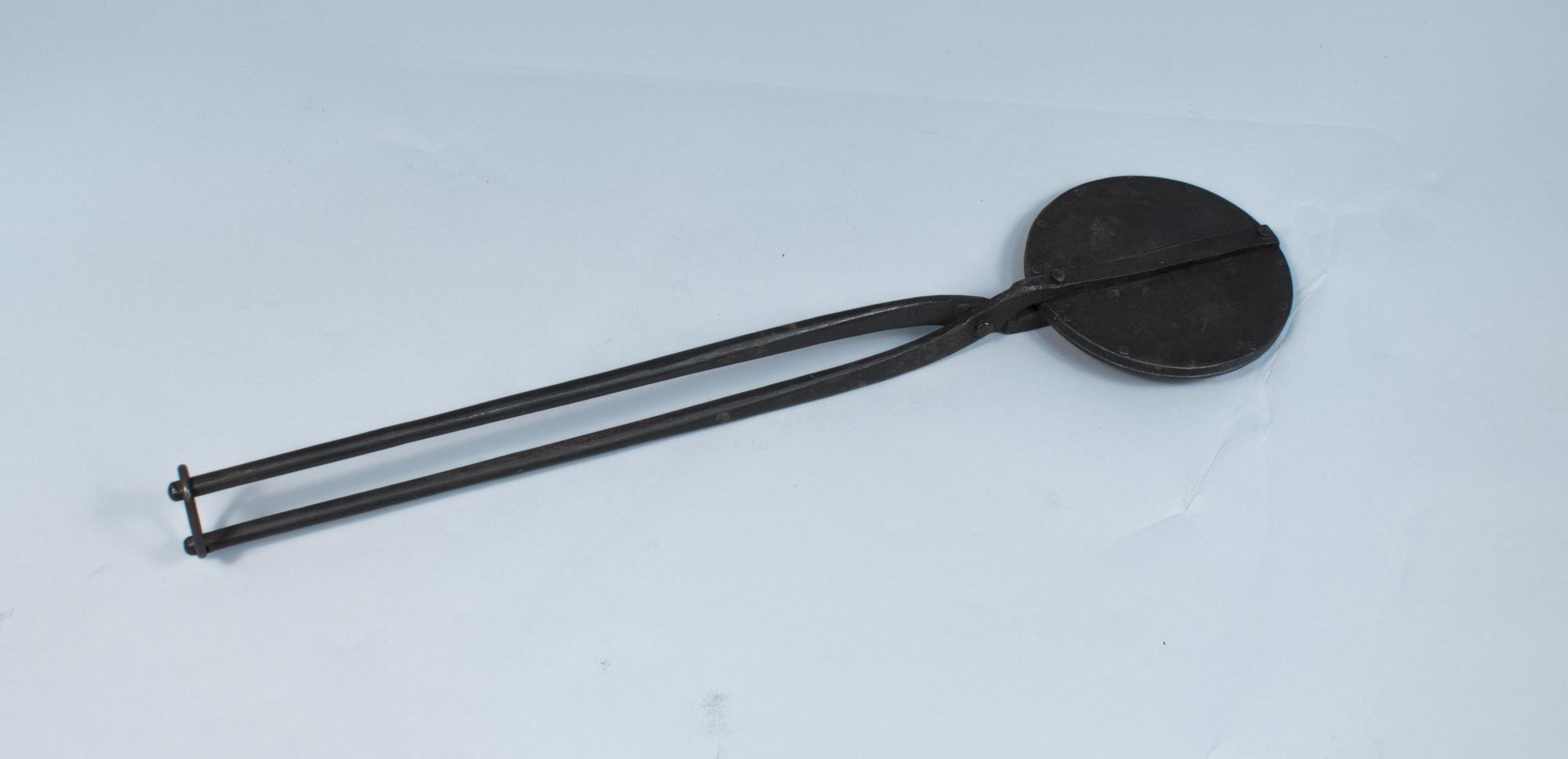 Image of Senbei iron from the Sagamiya Bakery with the Alaska-Yukon-Pacific Exposition (AYPE) seal, ca. 1909