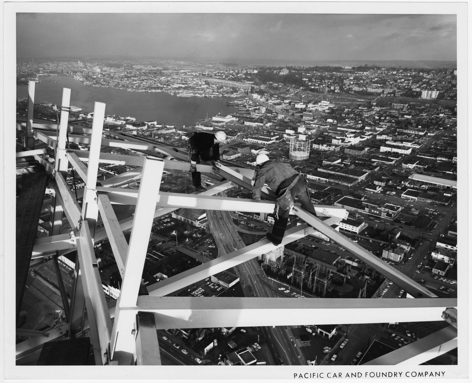 Image of Jack Edwards and Amby Wirkus working on a bracket for the Space Needle observation deck, 1961