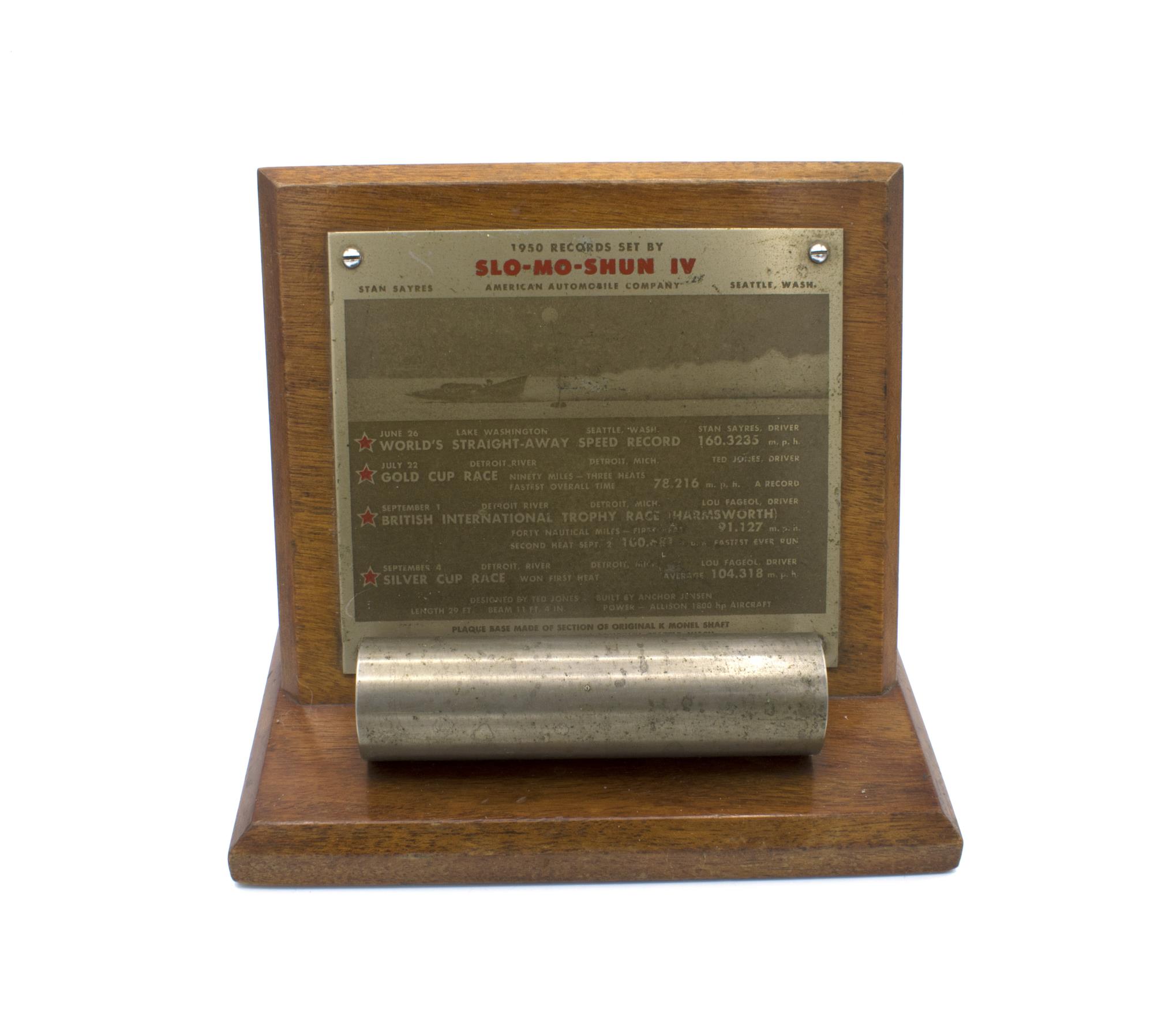 Image of Plaque listing the 1950 records set by Slo-Mo-Shun IV, displayed with a section of original K Monel Shaft, 1950