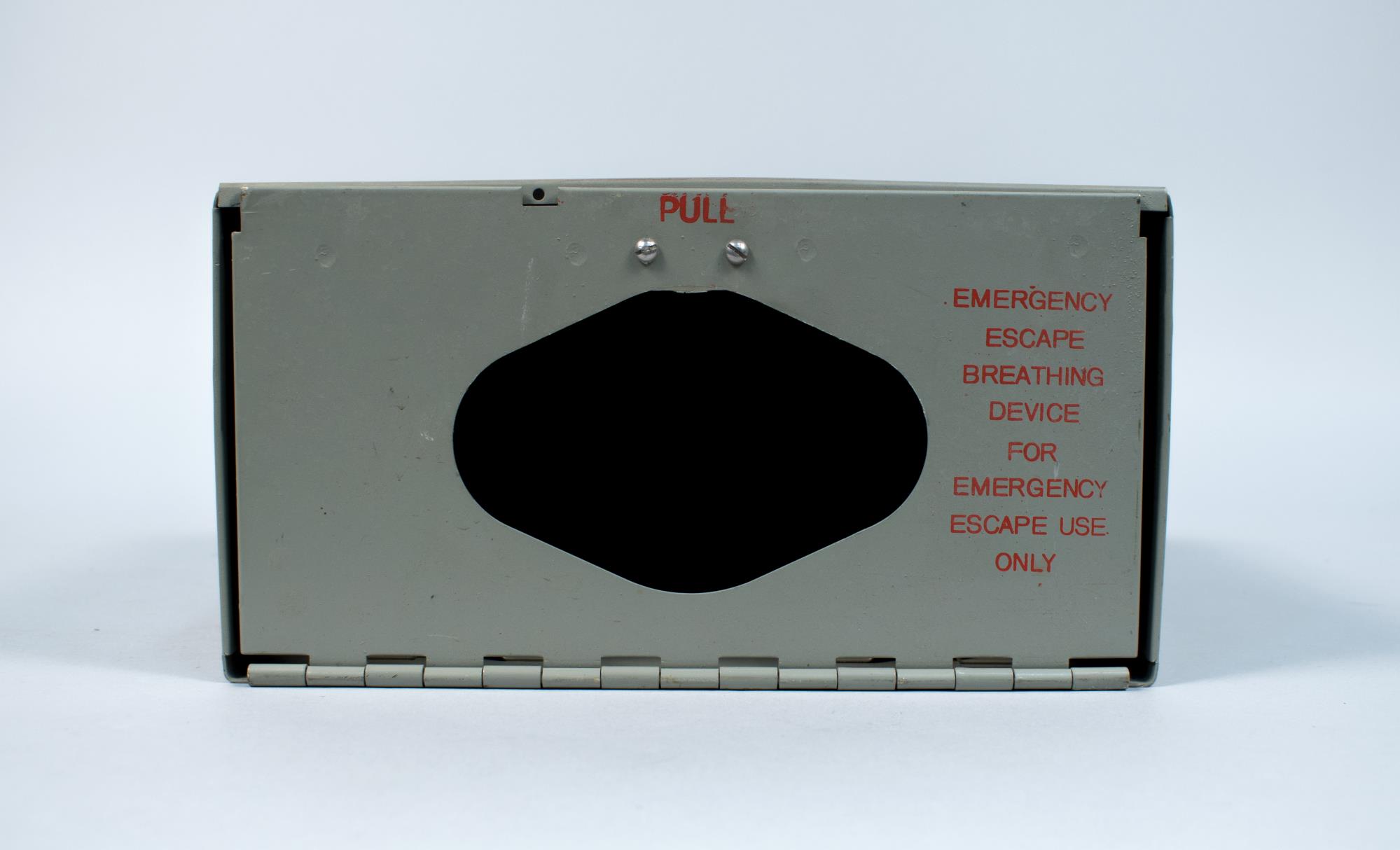 Image of Metal box for an Emergency Escape Breathing Device from the Tank Room in the Naval Reserve Center Armory building at South Lake Union, ca. 1941