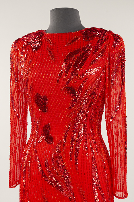 Image of Red crepe chiffon dress worn by Congresswoman Jennifer Dunn to a White House Christmas Party, ca. 1992-2004