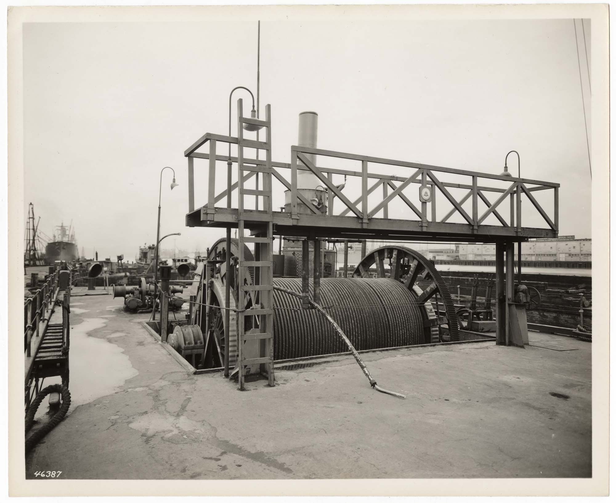 Image of Reel of submarine cable on a Pacific Telephone and Telegraph barge, Seattle, 1936