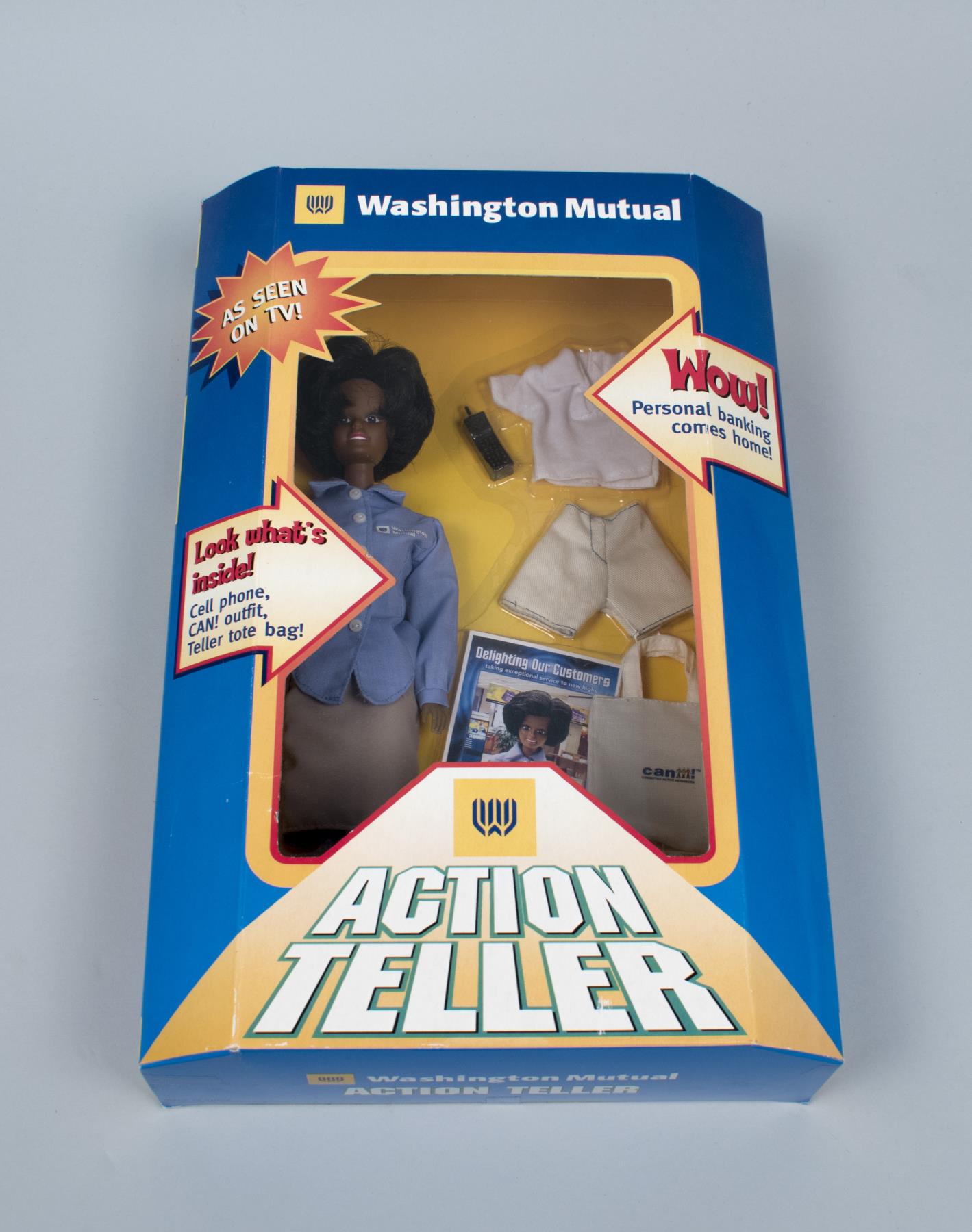 Image of Washington Mutual Bank action teller doll in original packaging with accessories, ca. 2000