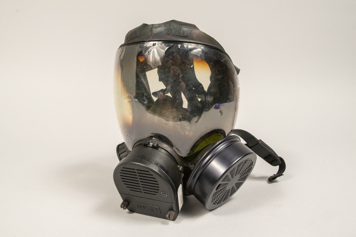 Image of Gas mask and carrying case used by Captain Jim Pugel during the World Trade Center (WTO) conference and protests in Seattle, 1999