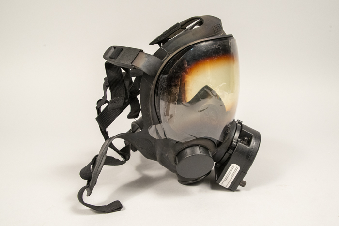 Image of Gas mask and carrying case used by Captain Jim Pugel during the World Trade Center (WTO) conference and protests in Seattle, 1999