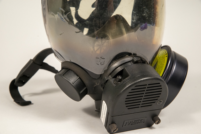 Image of Gas mask and carrying case used by Captain Jim Pugel during the World Trade Center (WTO) conference and protests in Seattle, 1999