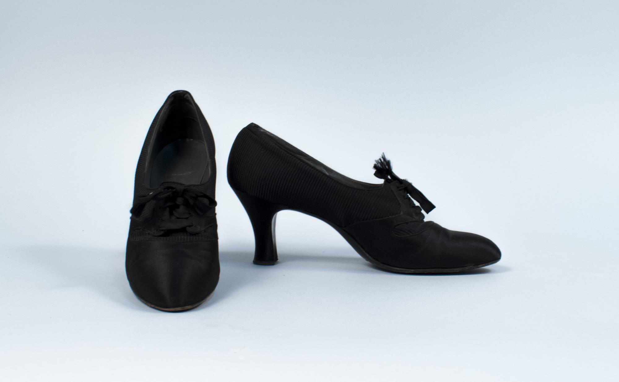 Image of Pair of black satin and grosgrain pumps with lace ties, 