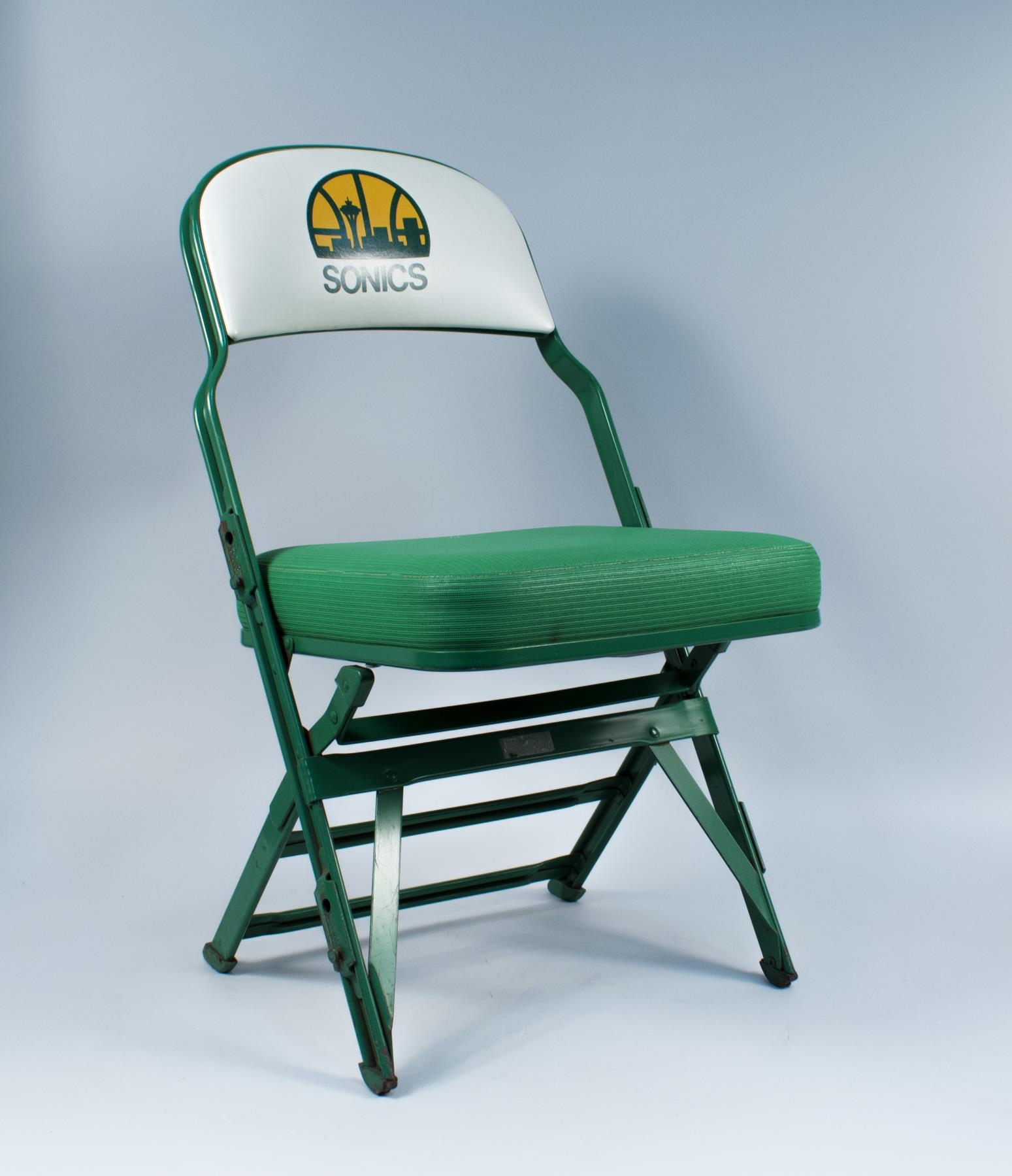 Image of Courtside folding chair for Seattle Sonics games at the Key Arena in Seattle, ca. 1994