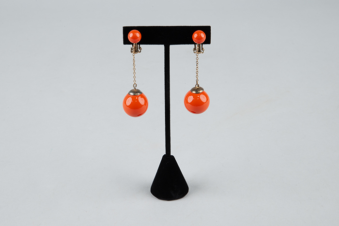 Image of Orange costume earrings, ca. 1971