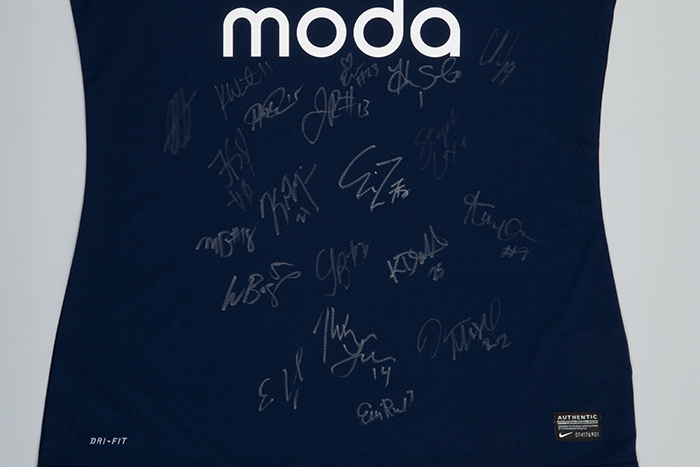 Image of Seattle Reign FC soccer jersey autographed by players, 2013