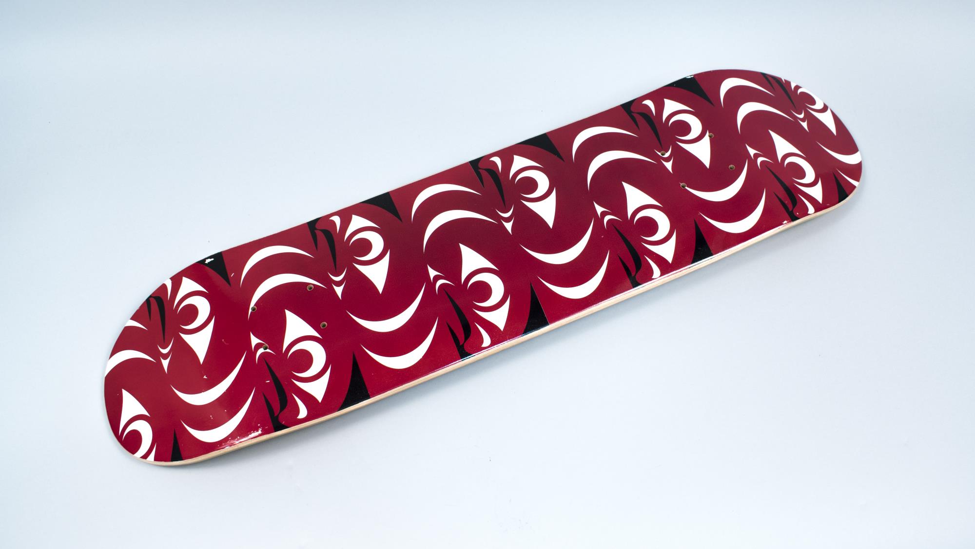 Image of Skateboard deck with Coast Salish design, made by Tulalip artist Ty Juvinel, ca. 2014