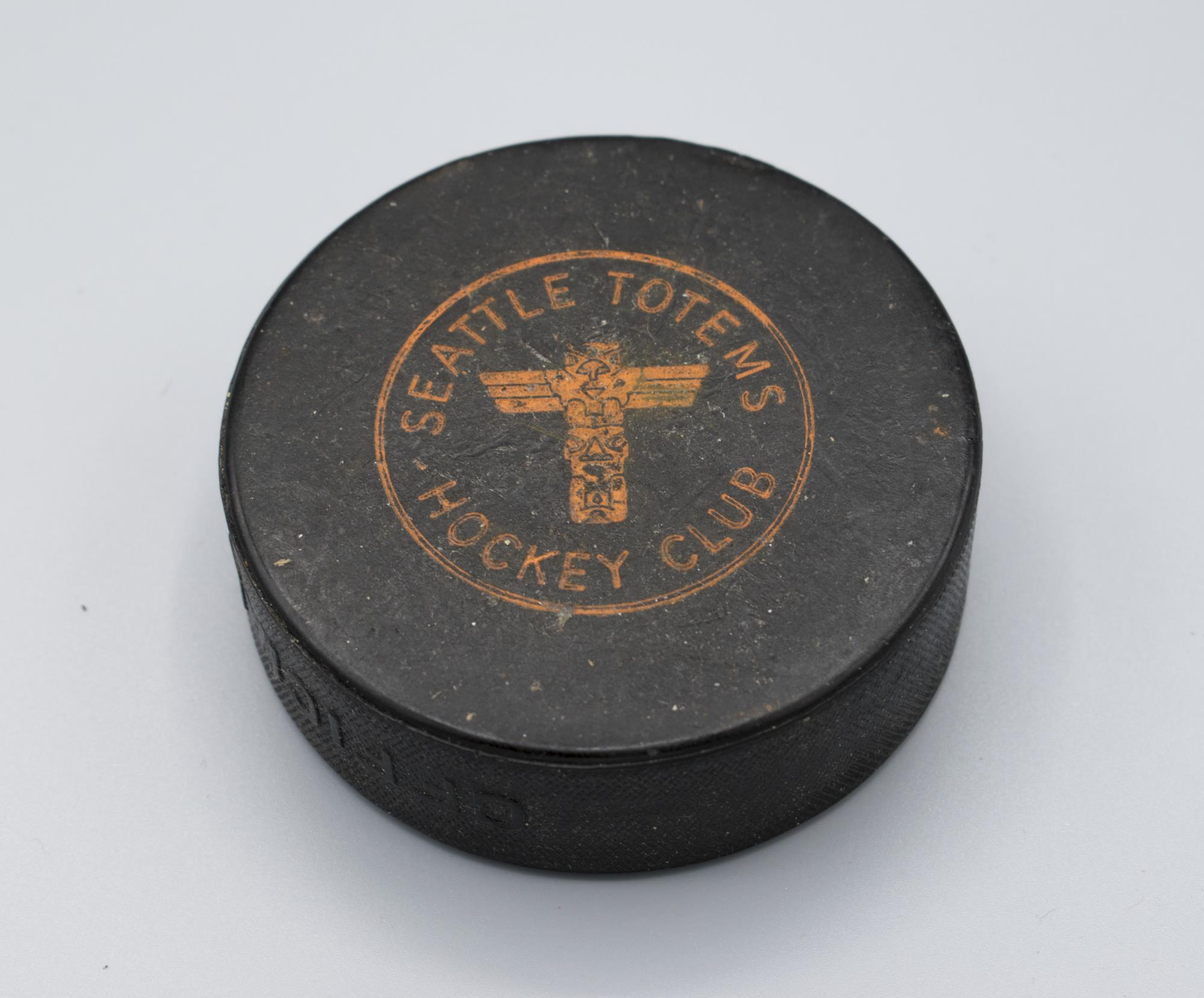 Image of Seattle Totems hockey puck, ca. 1960s