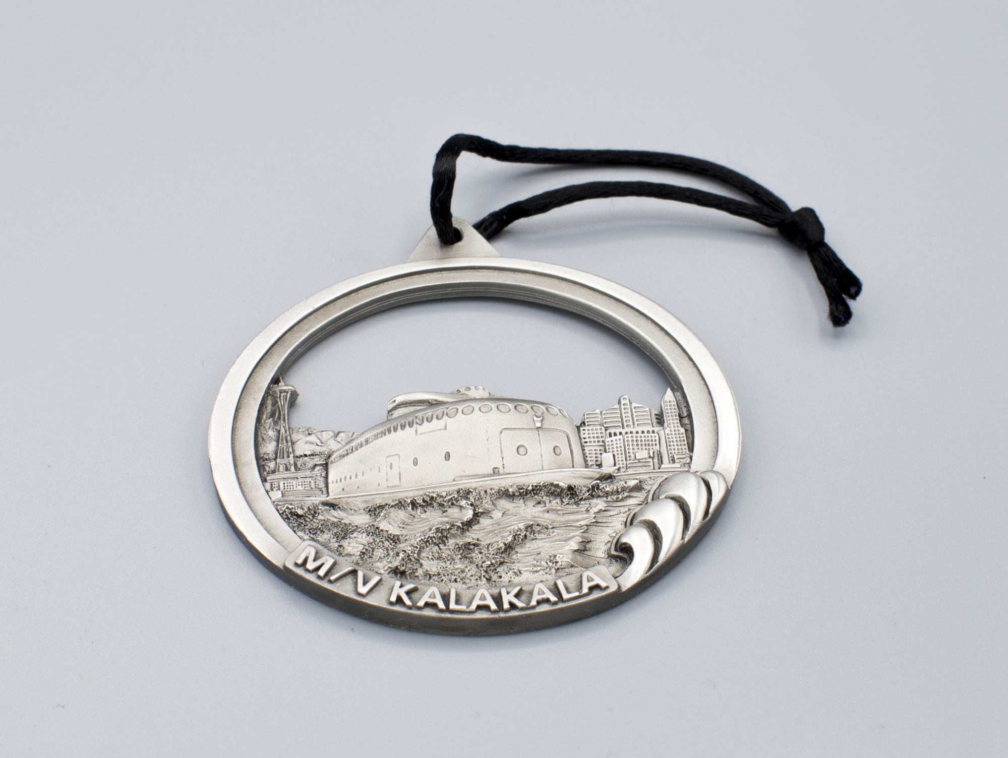 Image of Pewter holiday ornament featuring the M/V Kalakala made by local artist David Cusenza, 1998