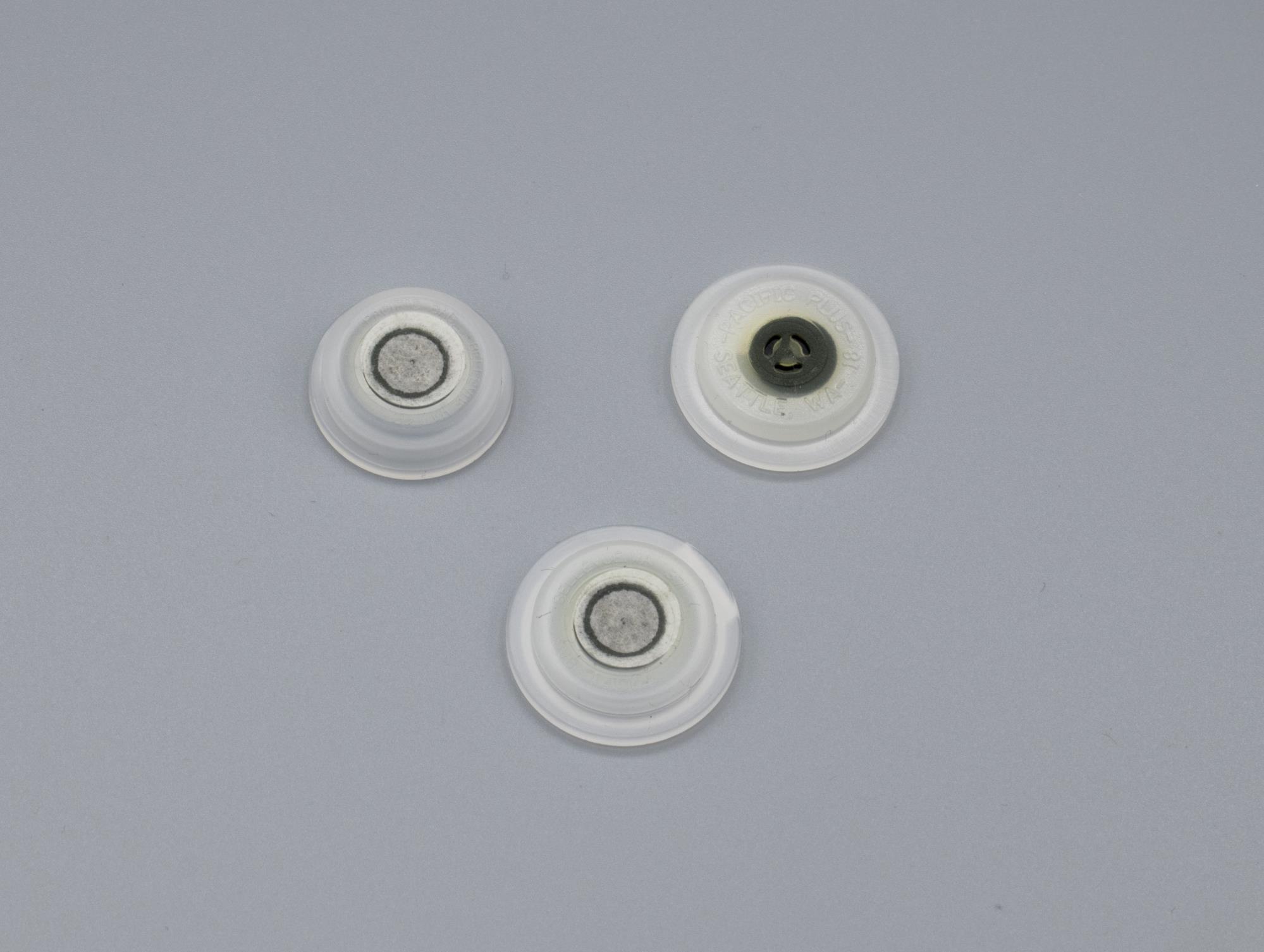 Image of Collection of three Pacific Bag, Inc. (PBI) One-Way Degassing Valves used in the packaging of coffee, invented by Ed Urquhart, ca. 1983