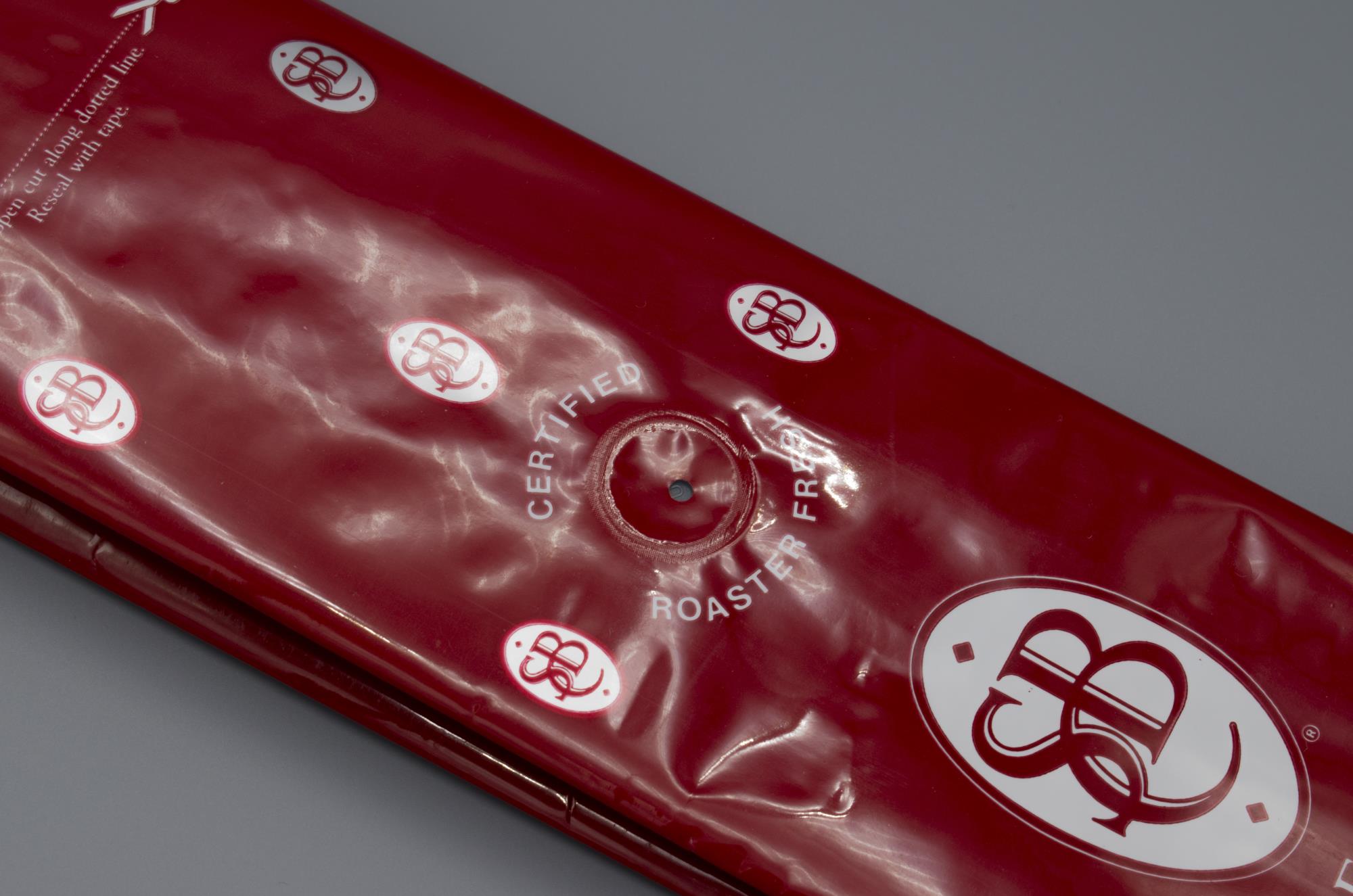 Image of Foil coffee bag from Seattle's Best Coffee featuring a Pacific Bag, Inc. (PBI) One-Way Degassing Valve invented by Ed Urquhart in 1983