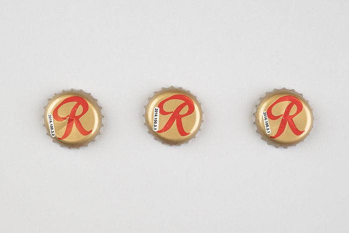 Image of Set of three Rainier Mountain Pale Ale beer bottle caps with rebus puzzles, 2016