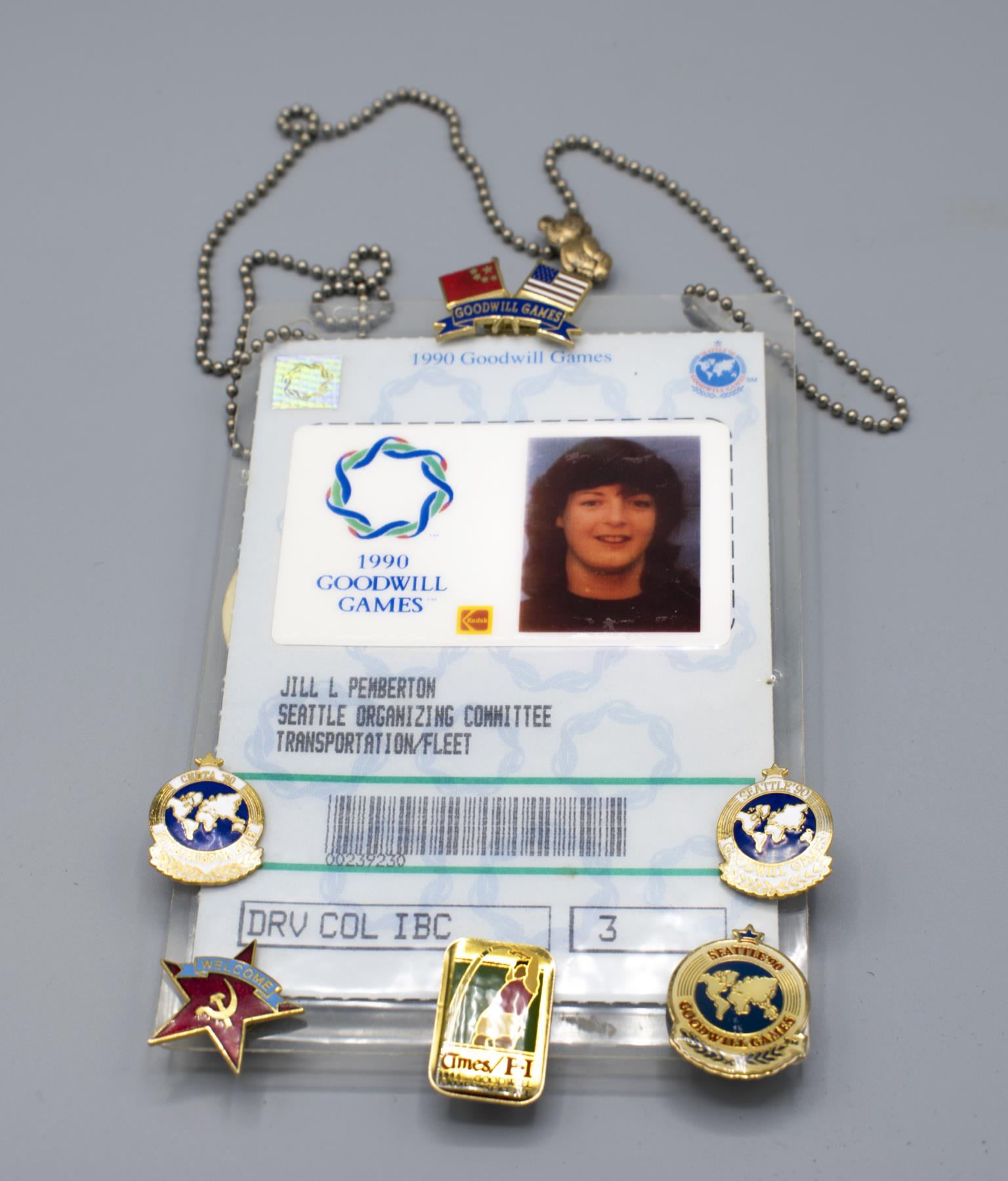 Image of Goodwill Games volunteer badge and pins for Jill Pemberton, 1990
