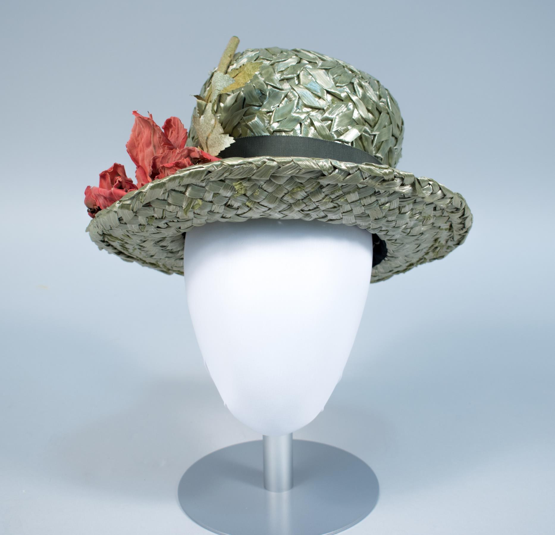 Image of Green straw hat with flower, made by John Eaton, 1960s
