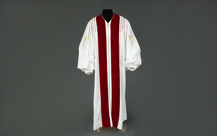 Image of White and red church robe, worn by Reverend Dr. Samuel B. McKinney, ca. 1980s