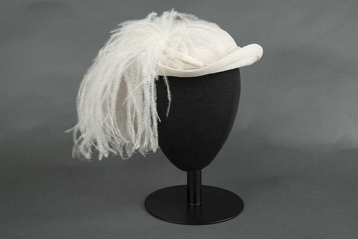 Image of Straw hat with large ostrich feather, designed by Ethel Young, ca. 1940s-1950s