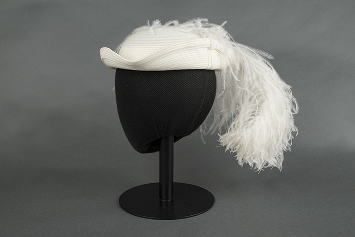 Image of Straw hat with large ostrich feather, designed by Ethel Young, ca. 1940s-1950s