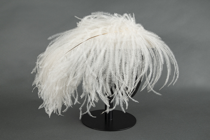 Image of Straw hat with large ostrich feather, designed by Ethel Young, ca. 1940s-1950s