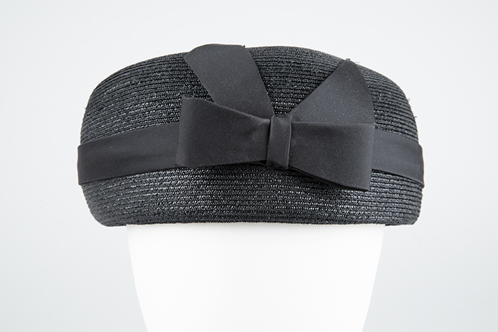 Image of Black straw pillbox hat designed by Ethel Young, ca. 1950s-1960s