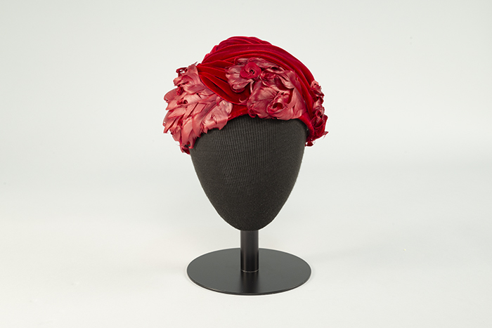 Image of Red velvet hat with feathers, sold at Best's Apparel, ca. 1950s-1960s