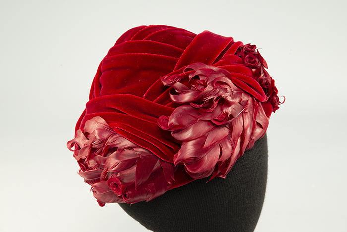 Image of Red velvet hat with feathers, sold at Best's Apparel, ca. 1950s-1960s
