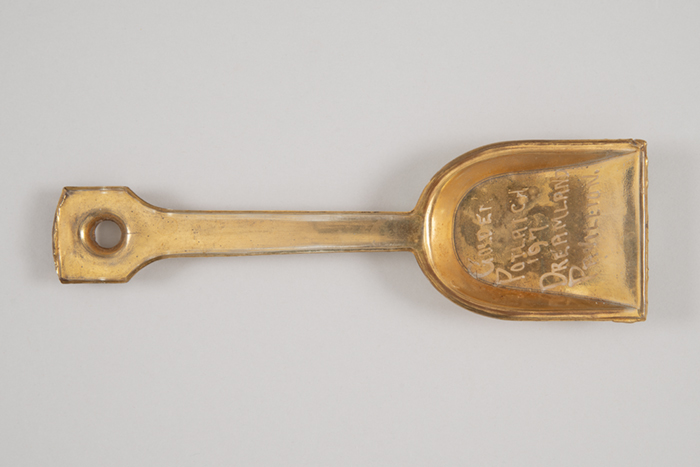 Image of Souvenir glass shovel from the 1911 Seattle Golden Potlatch celebration