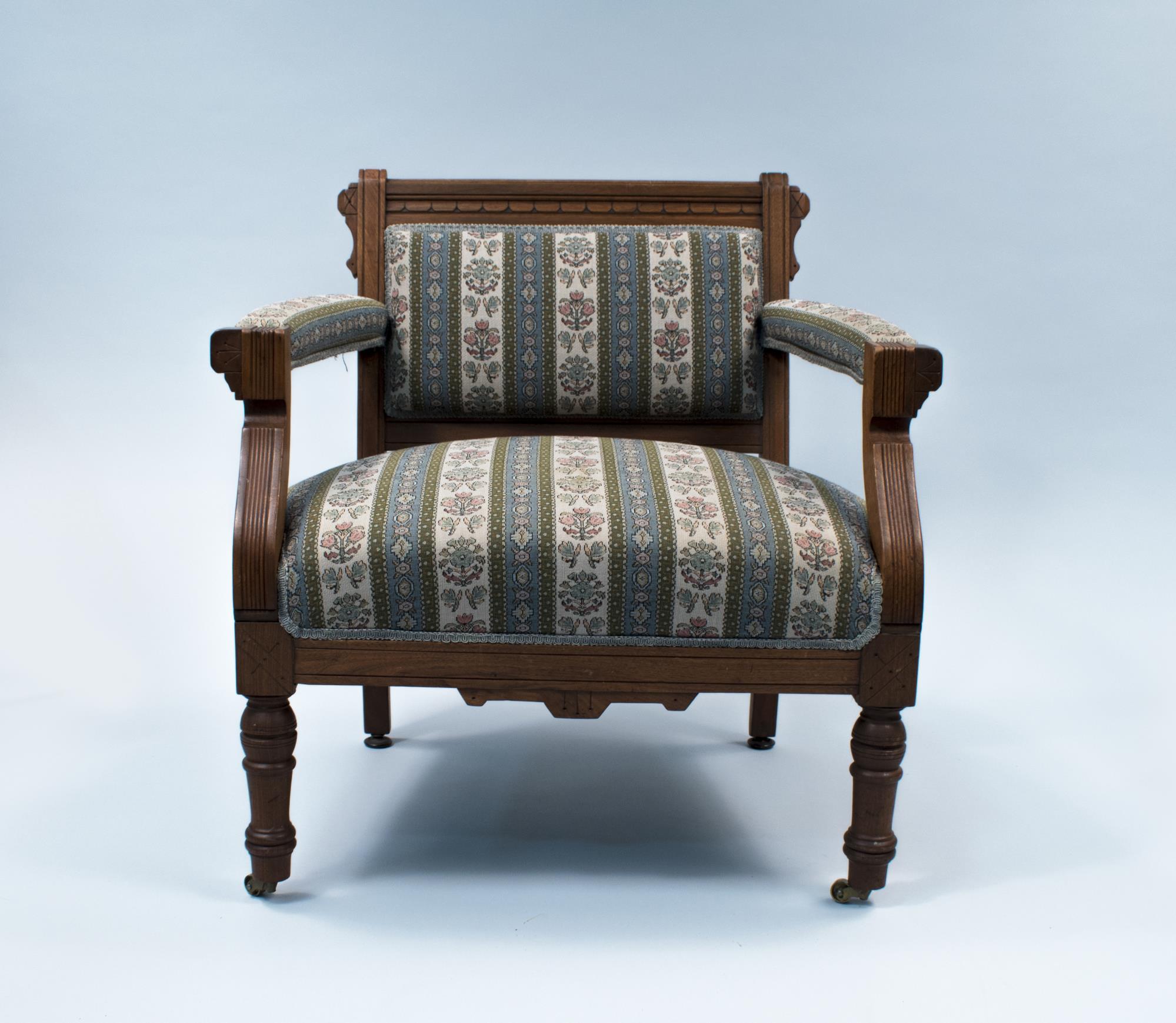 Image of Upholstered wooden chair from the Frye Opera House, ca. 1885