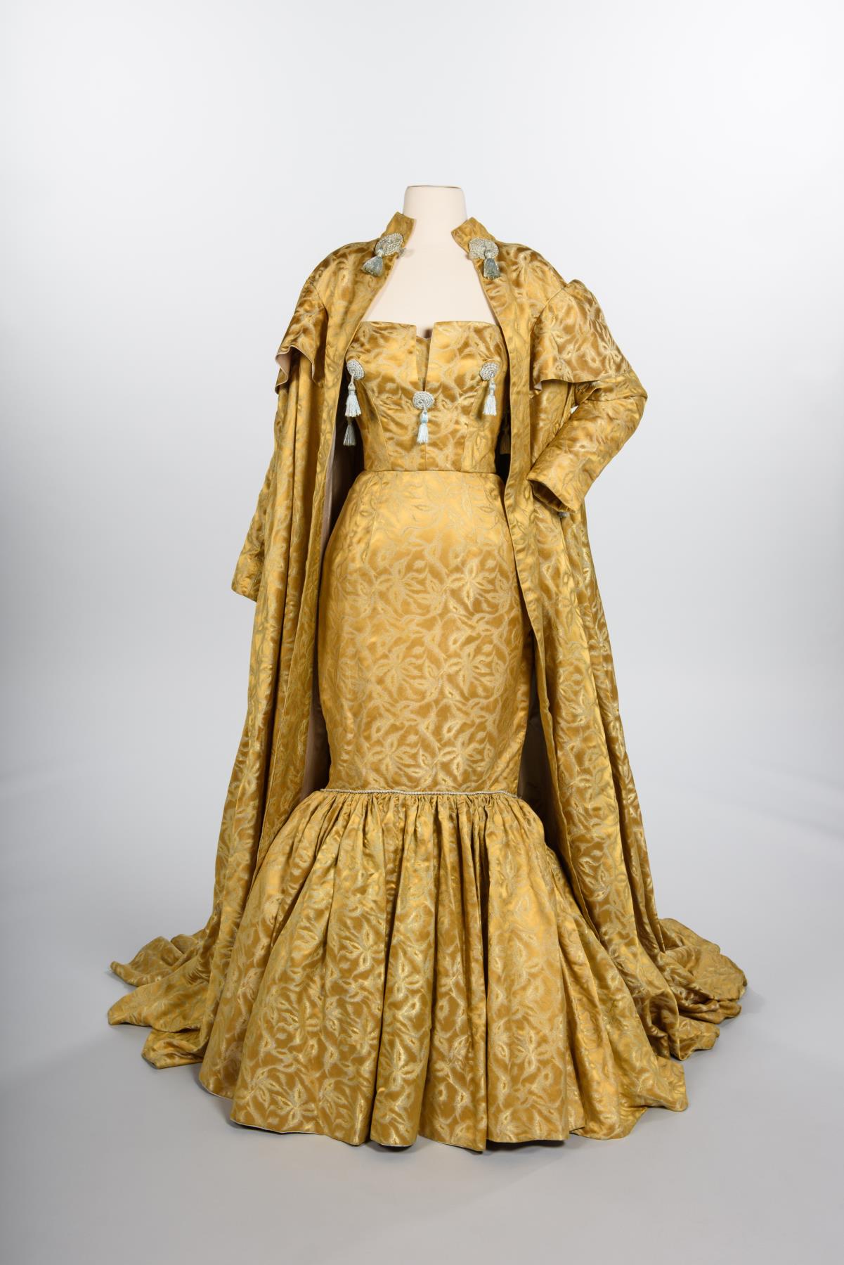 Image of Gold silk gown and coat designed by Howard Blair, 1959