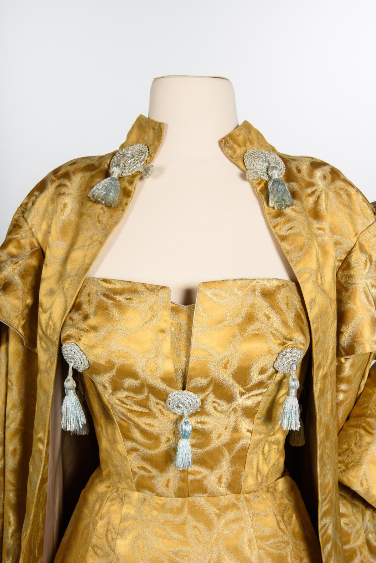 Image of Gold silk gown and coat designed by Howard Blair, 1959