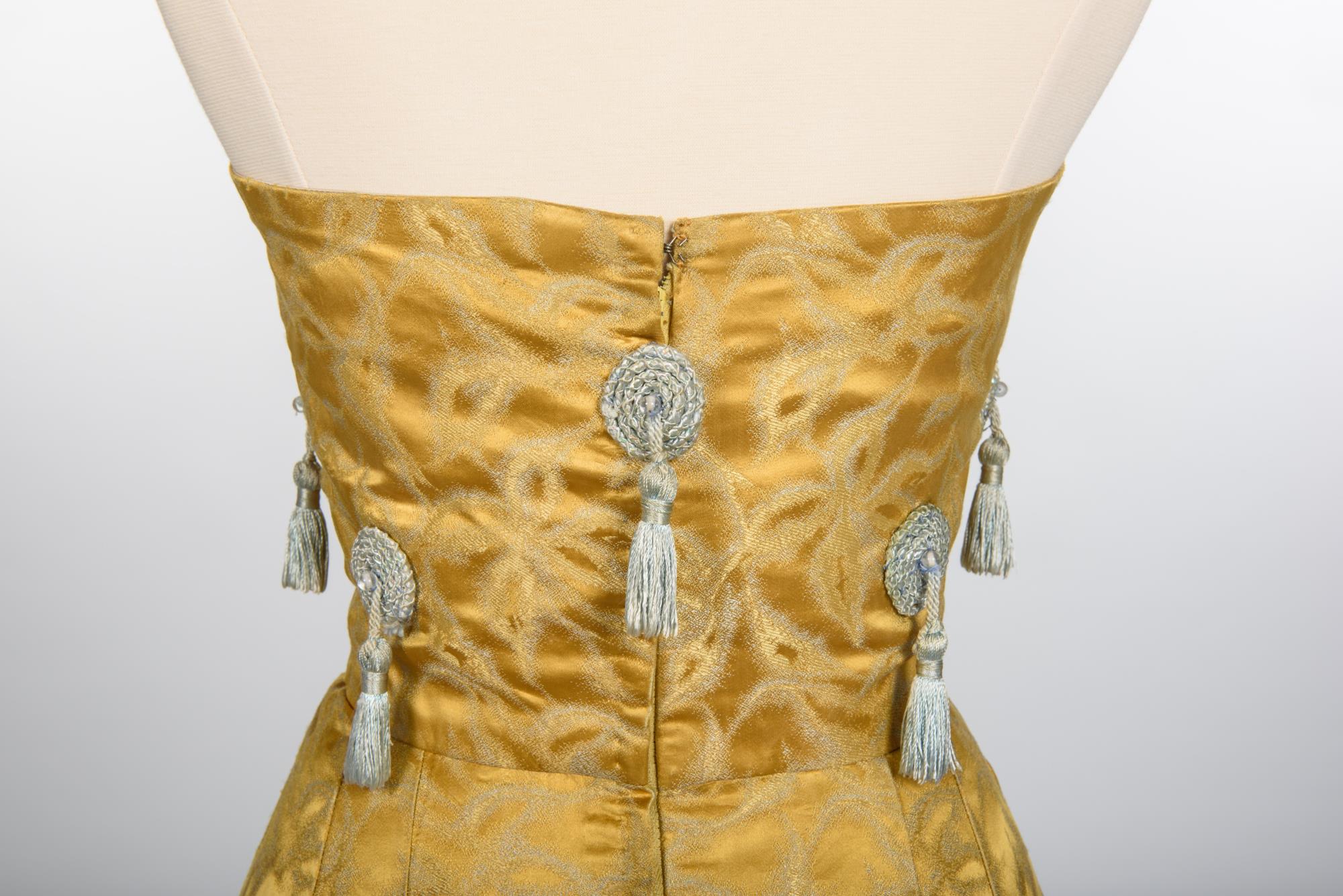 Image of Gold silk gown and coat designed by Howard Blair, 1959