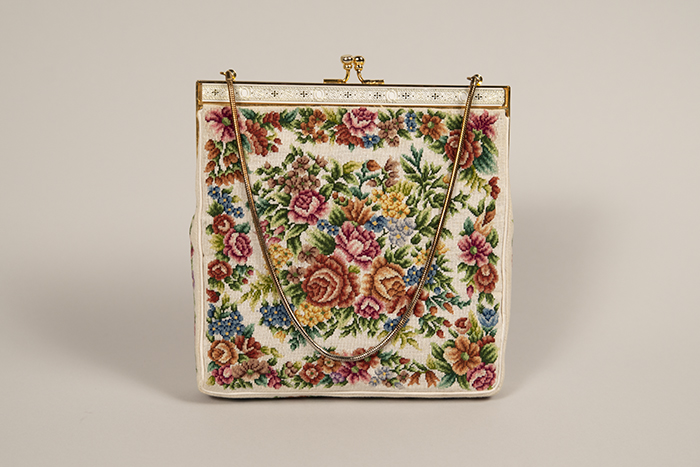 Image of White purse with needlepoint flower design, ca. 1940s