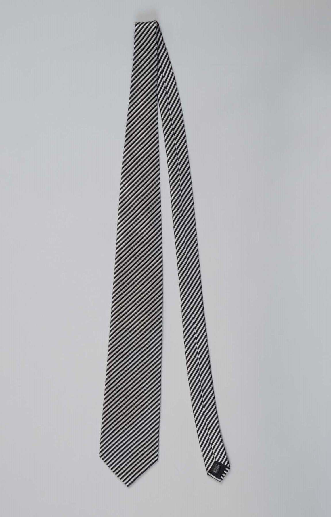 Image of Black and white necktie worn by Reverend Dr. Samuel B. McKinney, 1990s
