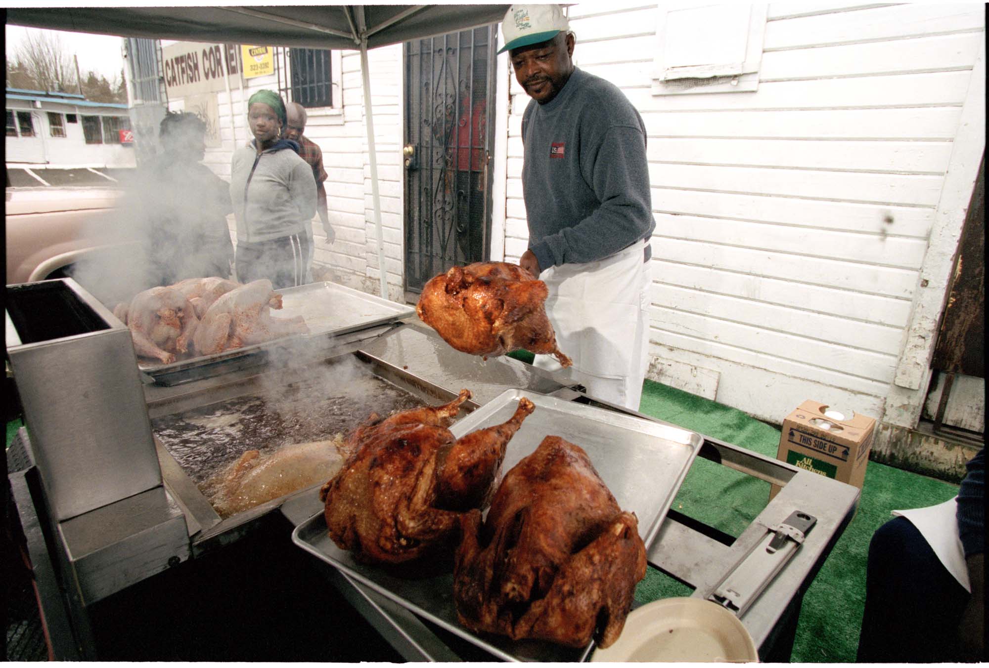 Image of Woody Jackson frying turkeys outside Catfish Corner, Seattle, November 20, 2001