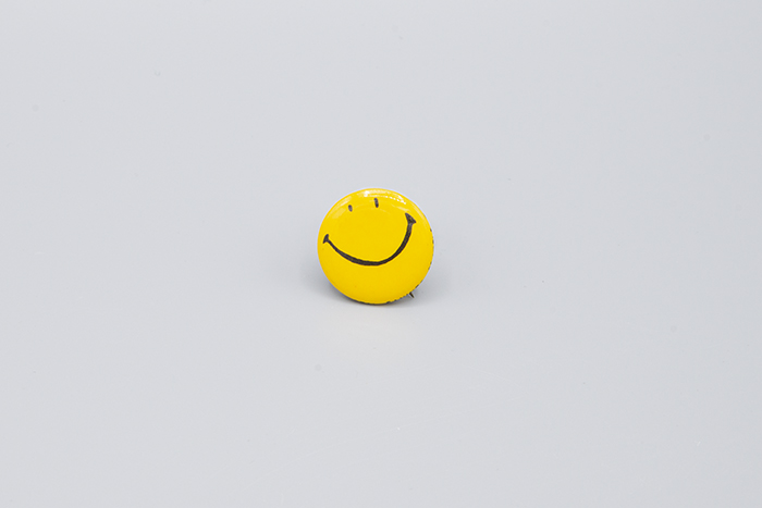 Image of Smiley face pin from University Federal Savings, 1967