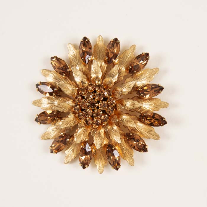 Image of Gold colored brooch with topaz rhinestones, ca. 1960s