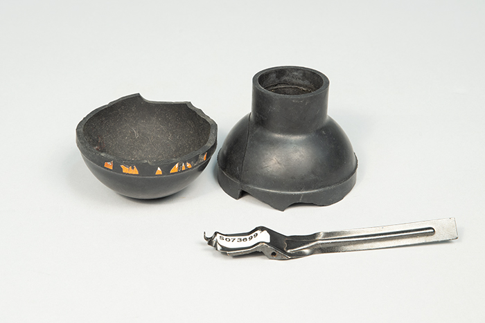 Image of Three remnant pieces of a flash-bang grenade from the World Trade Organization (WTO) protests, 1999
