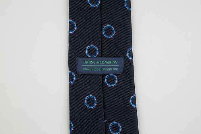 Image of Dark blue Brase & Company necktie from the Goodwill Games, 1990