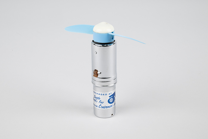 Image of Handheld battery powered fan from the Seattle World's Fair, 1962