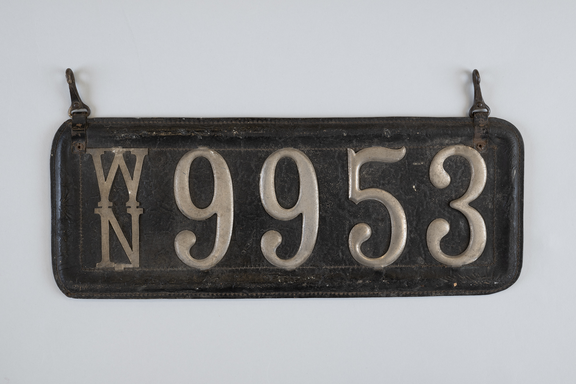 Image of Leather license plate from a Seattle hack, 1911