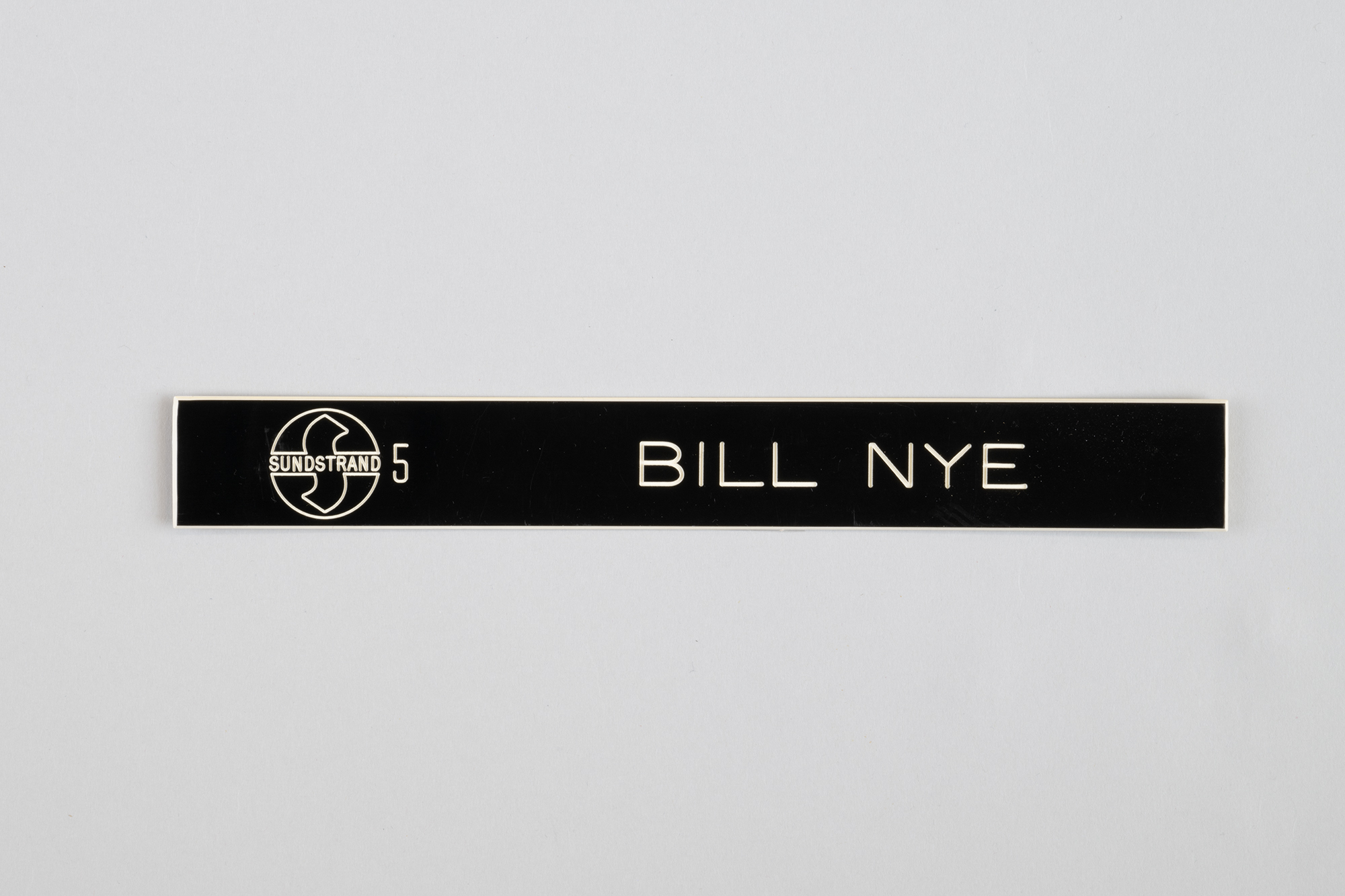 Image of Bill Nye's nameplate from Sundstrand, early 1980s