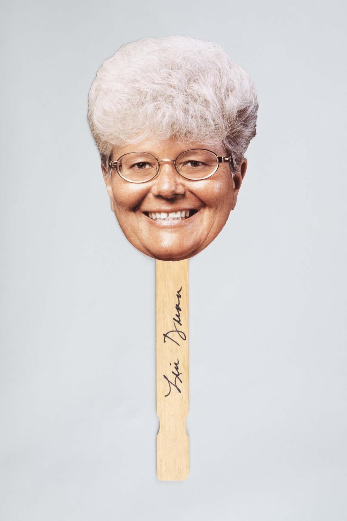 Image of Photo of Coach Lin Dunn's head on a stick, signed, 1999-2002