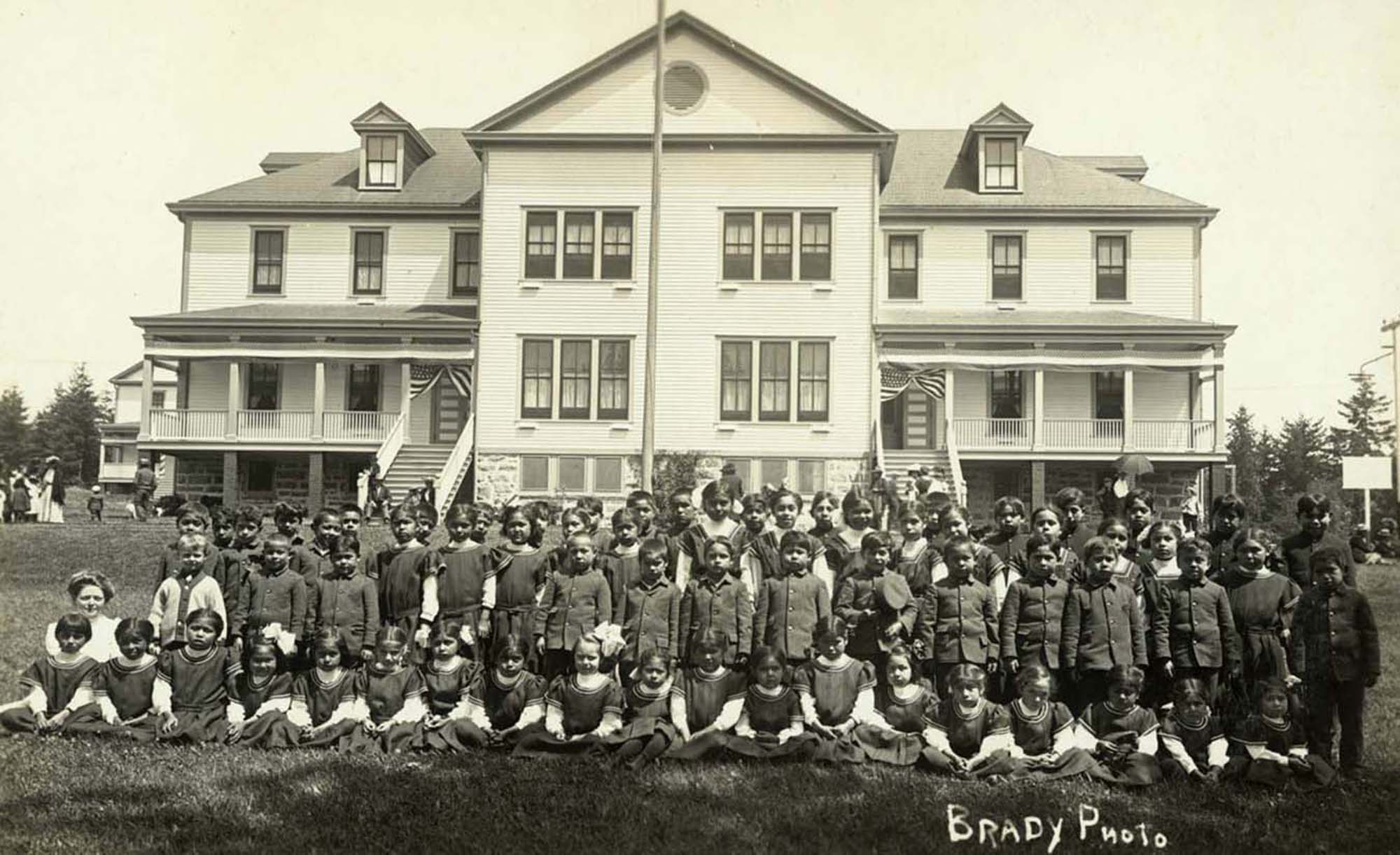 Image of Children in front of girls' dormitory building, Tulalip Indian School, circa 1912