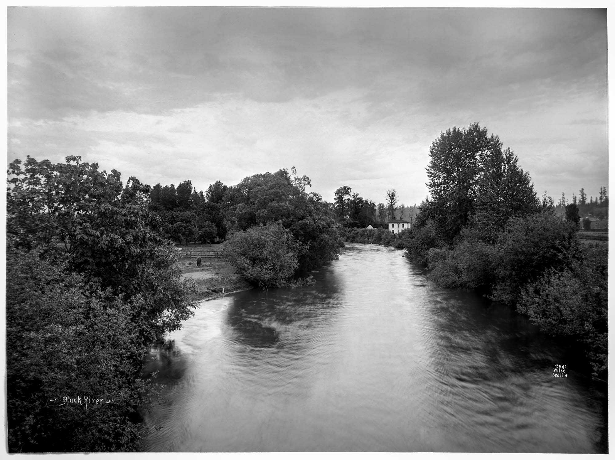 Image of Black River with farmhouse in distance, circa 1899
