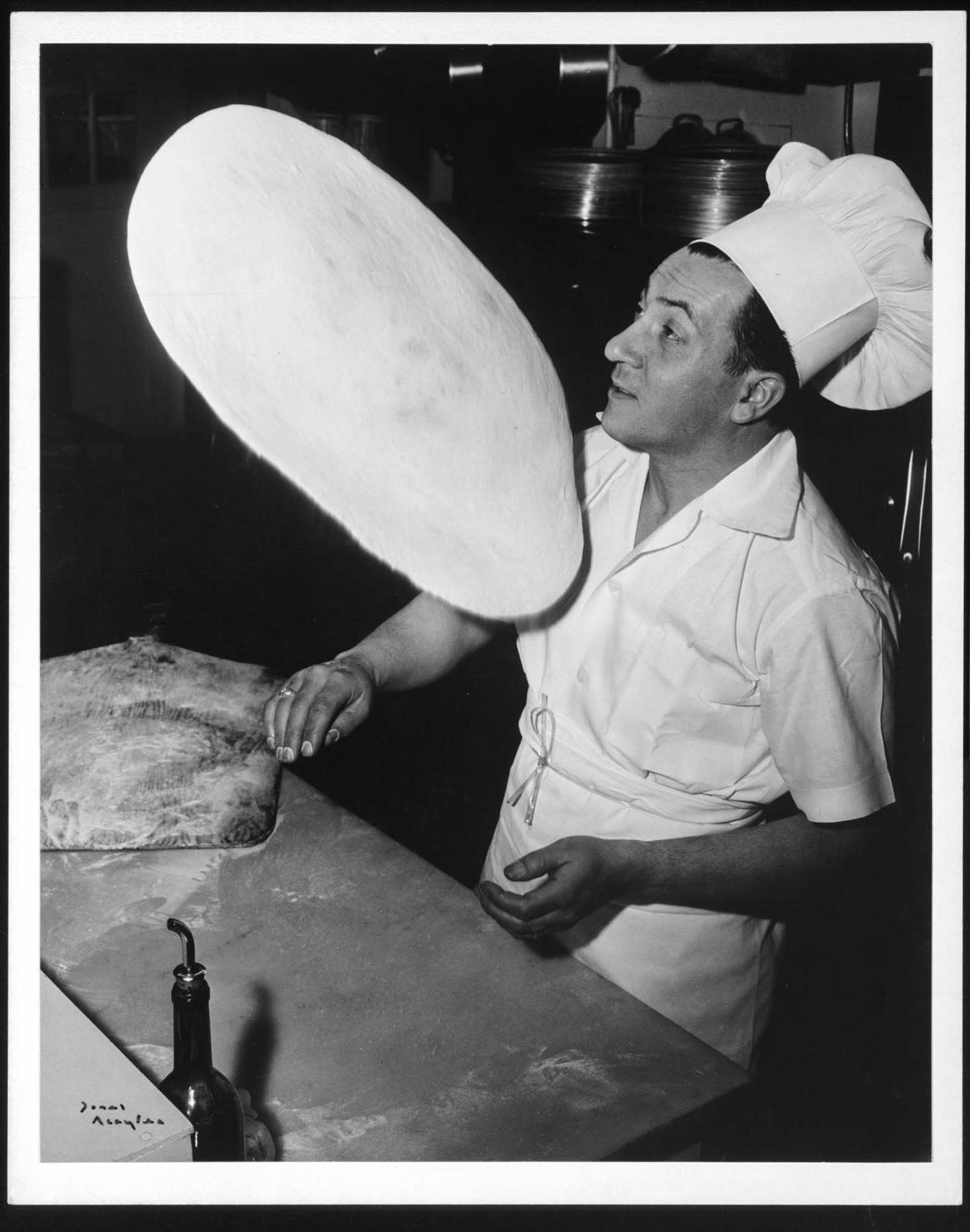 Image of Vince Giuffre making pizza, Seattle, 1954