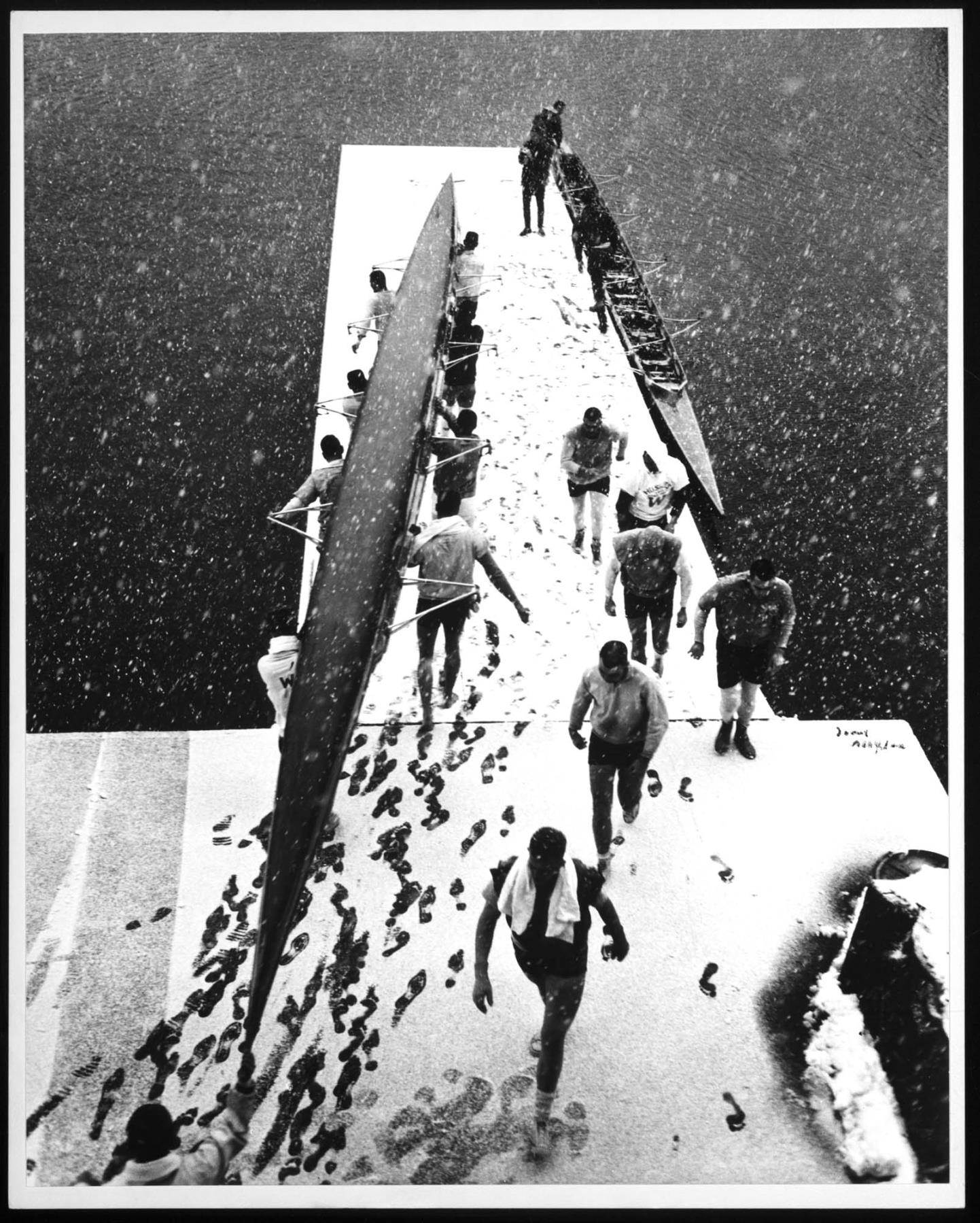 Image of University of Washington crew team hauling shells in snow, Seattle, March 1962