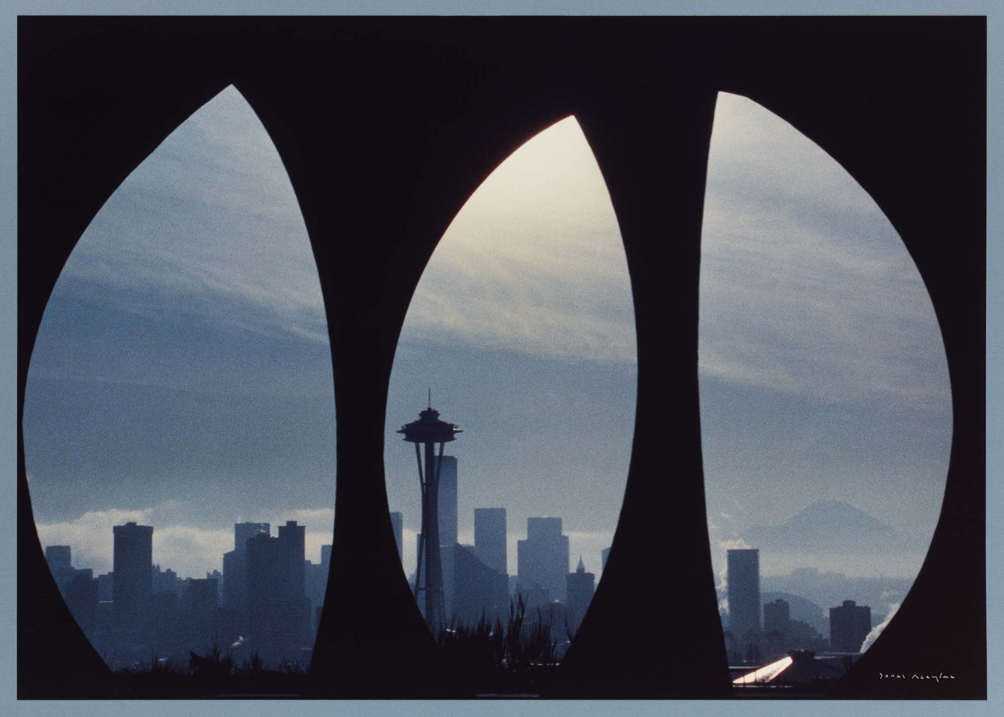 Image of View of downtown and Mount Rainier through Doris Chase's sculpture 